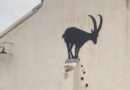 Banksy stencil of a goat on a shallow ledge - close up
